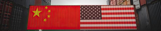 US and China flags in front of freight containers