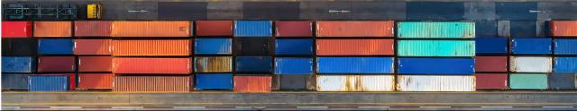 Dock view of stacked freight shipping containers