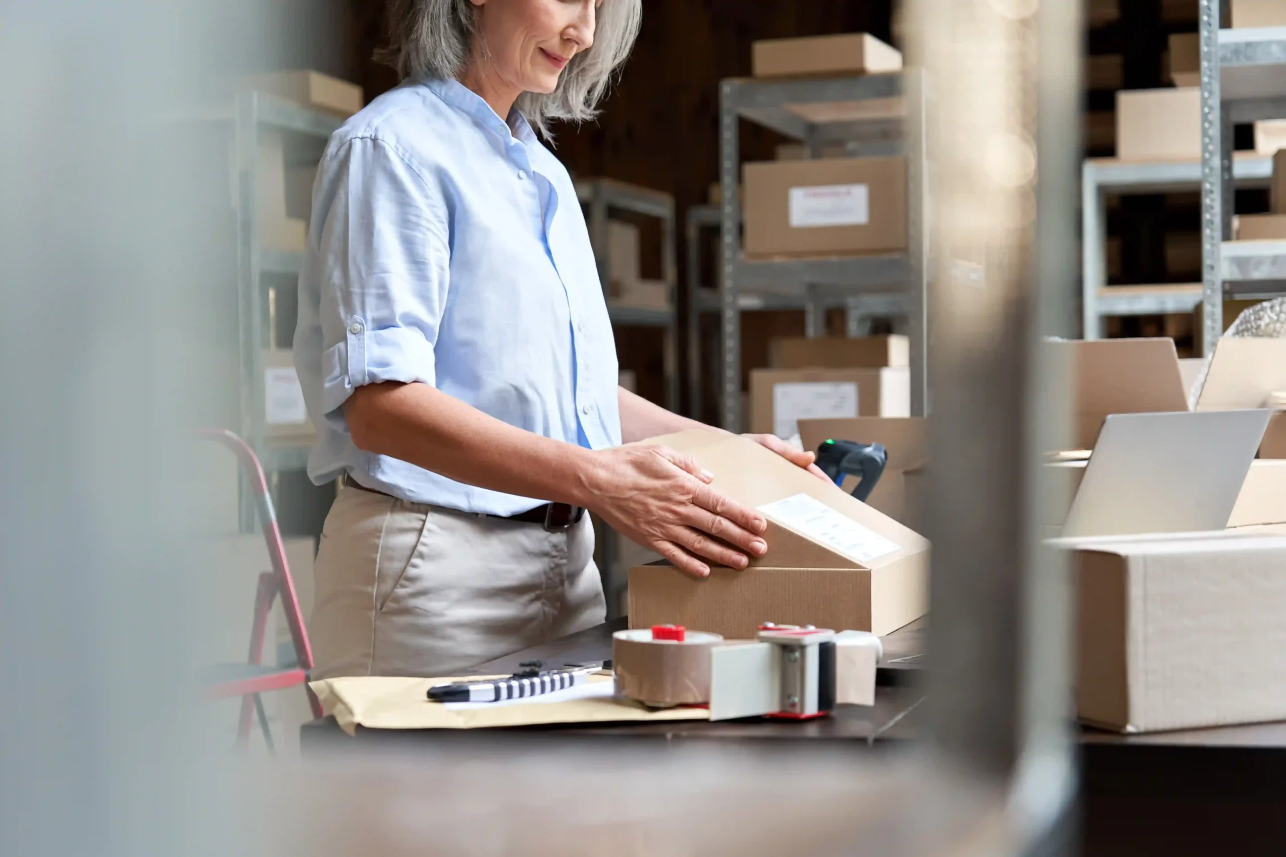 E-commerce business owner packing products for fast and reliable order fulfillment.