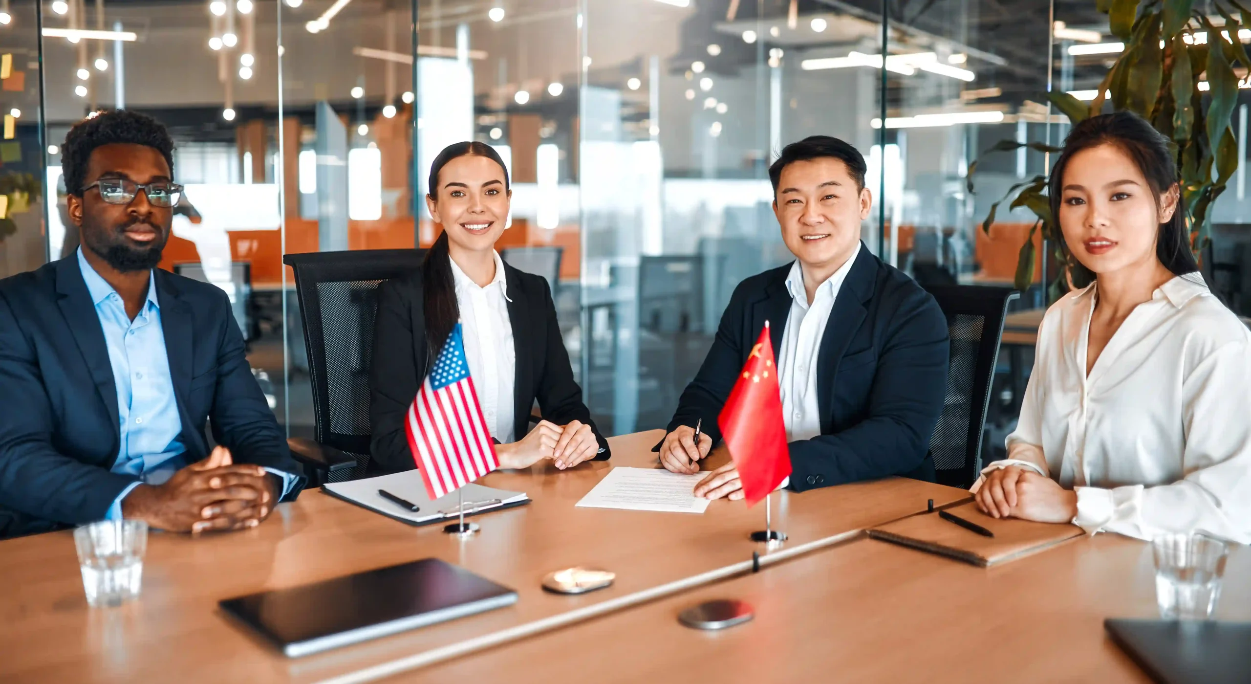 Business professionals discussing trade policies between the U.S. and China, highlighting the impact of Trump tariffs on global trade.