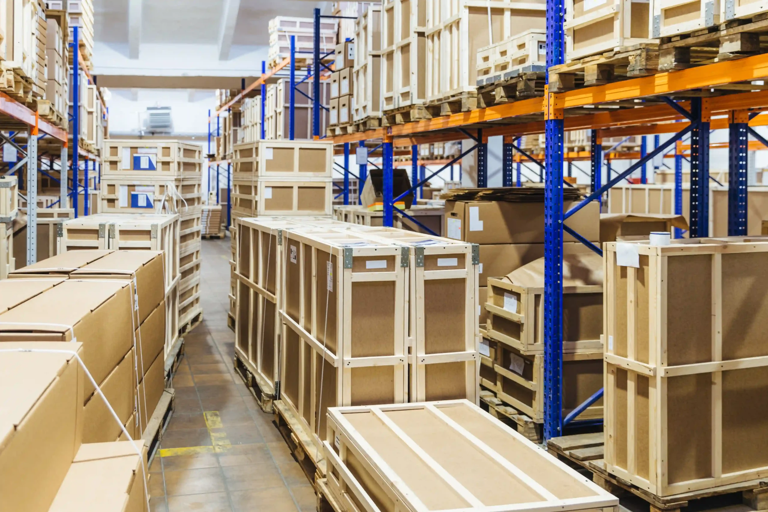 Rows of warehouse vertical storage solutions with high-density shelving and packed inventory for efficient space utilization.