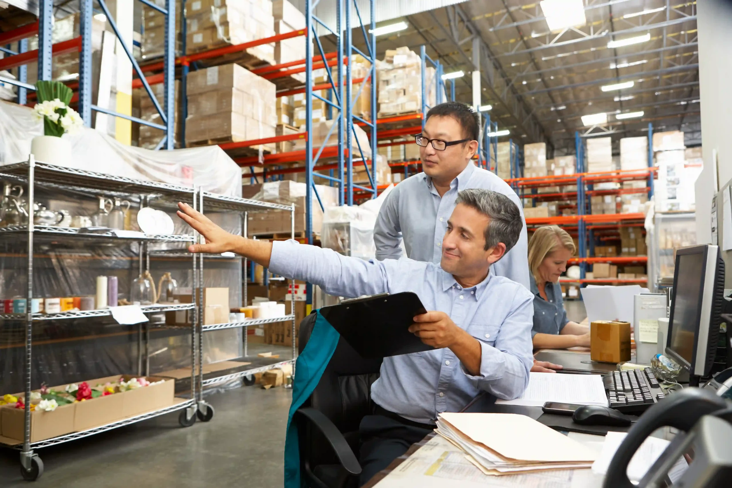 Supply chain professionals analyzing real-time data to optimize inventory management and improve delivery efficiency.
