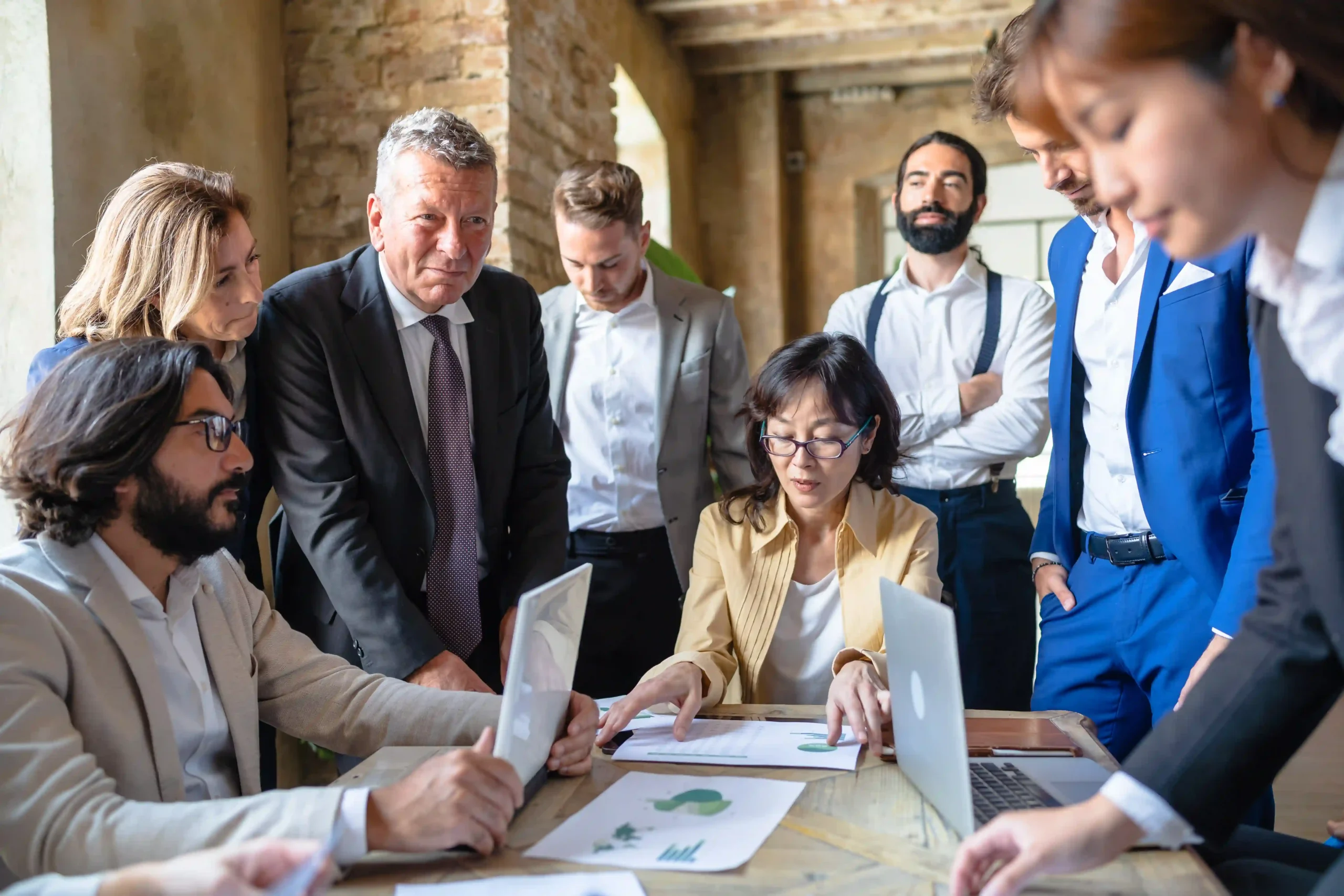 Corporate executives in a formal meeting discussing government regulations. Discover what are the most regulated industries and how businesses can stay compliant.