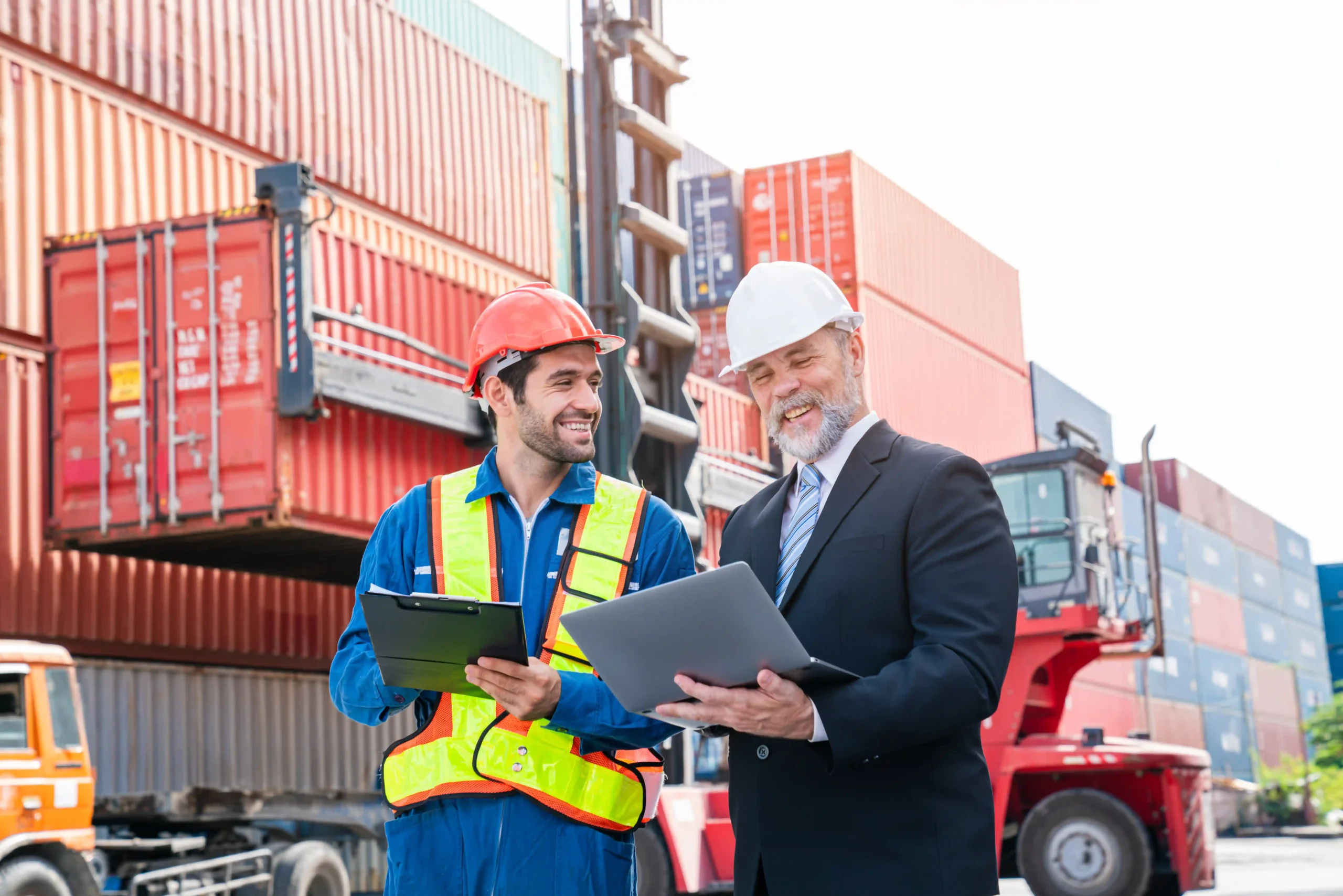 Port and logistics professionals discussing FTZ certification and setup process at a busy shipping yard.