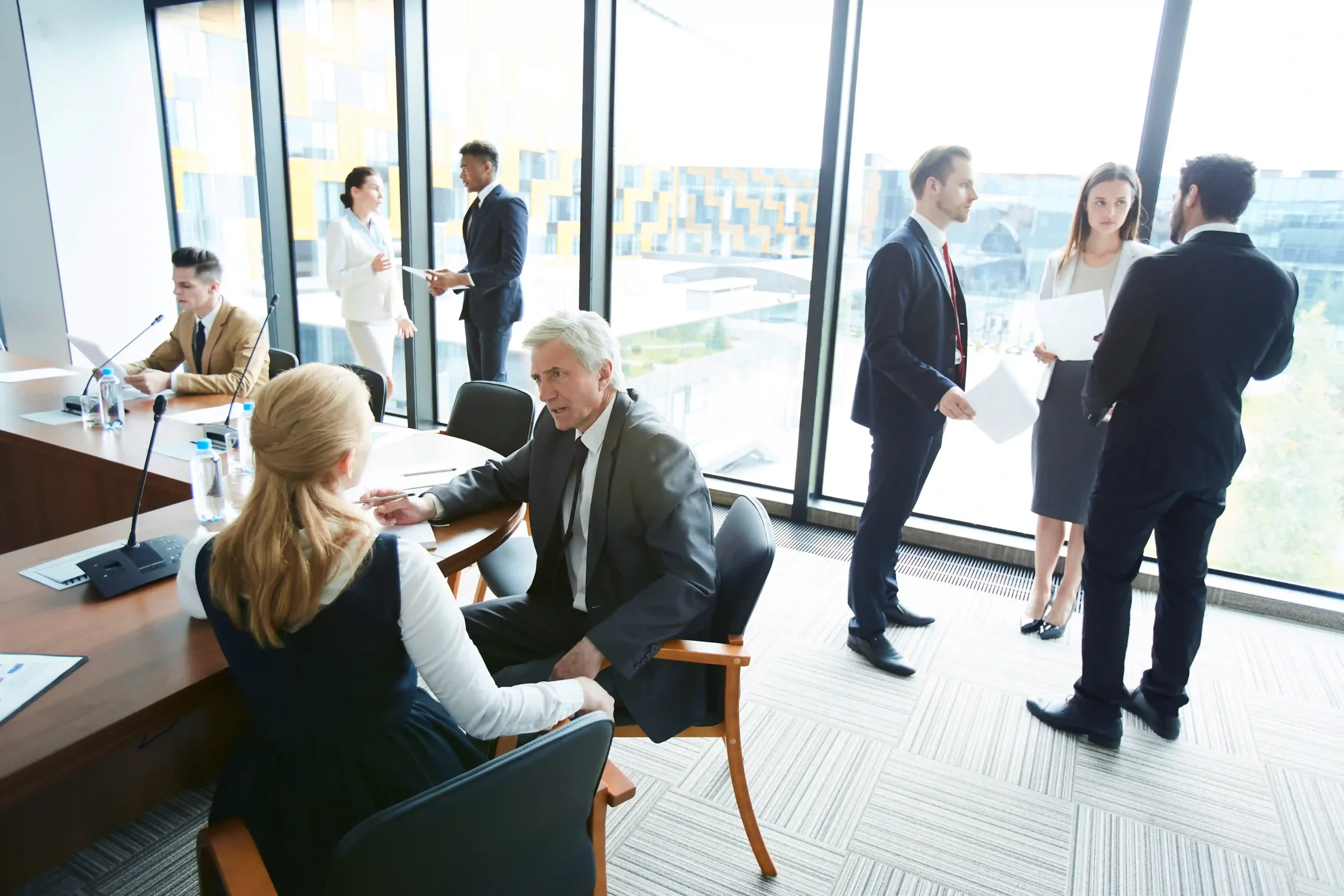 A diverse team of business professionals analyzing industry regulations and compliance strategies. Explore what are the most regulated industries.