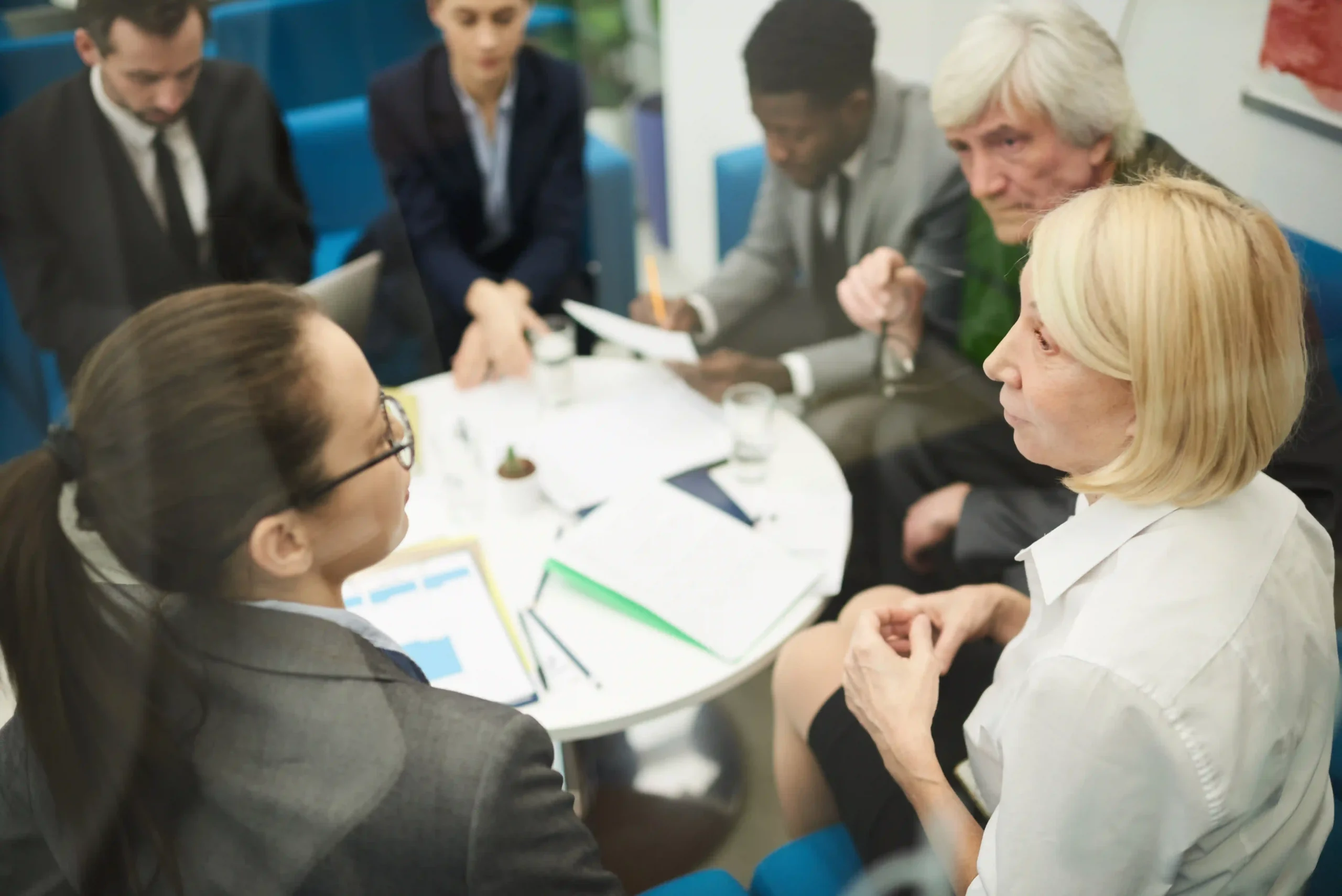 Corporate team analyzing regulatory frameworks in a boardroom, emphasizing how the EPA regulates environmental policies.