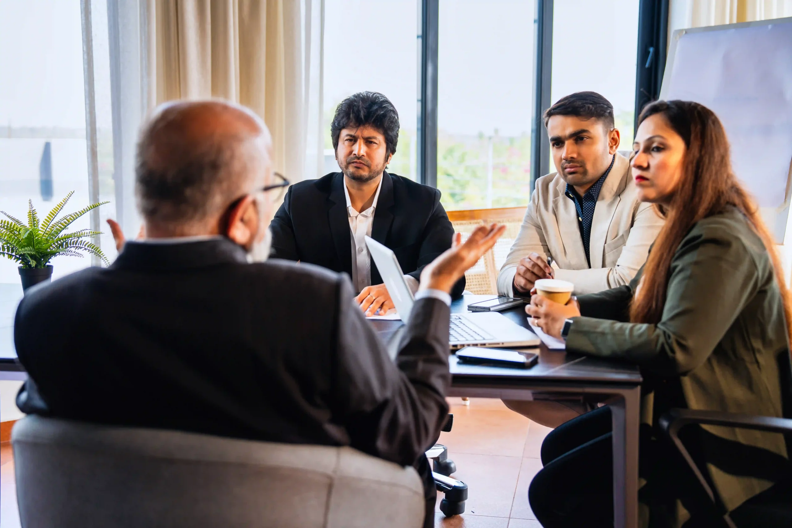 Group of Indian and Asian business professionals reviewing the latest updates on how the EPA regulates environmental compliance.