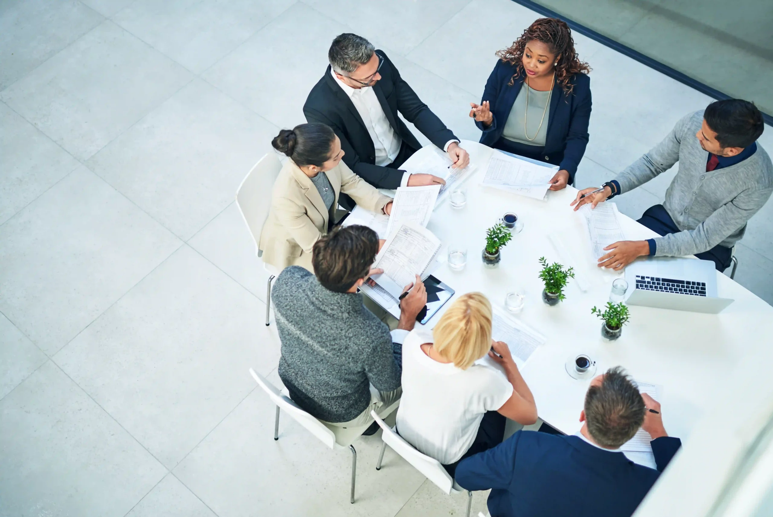 A meeting in progress where professionals analyze EPA regulations and their impact on business logistics. The discussion explores is EPA reliable in enforcing pollution control laws.