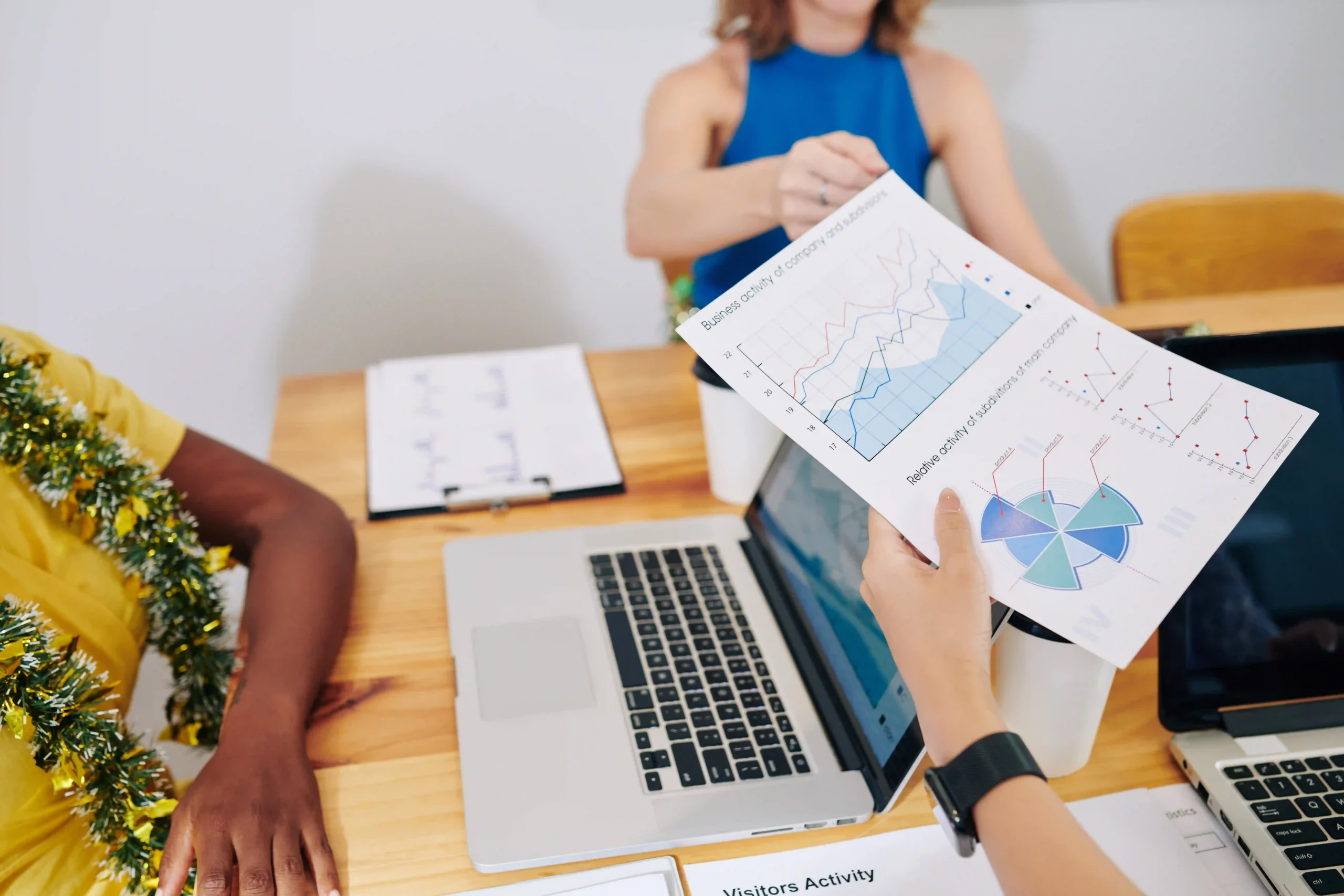 Professionals sharing a financial report with custom report types, focusing on business growth and performance tracking.