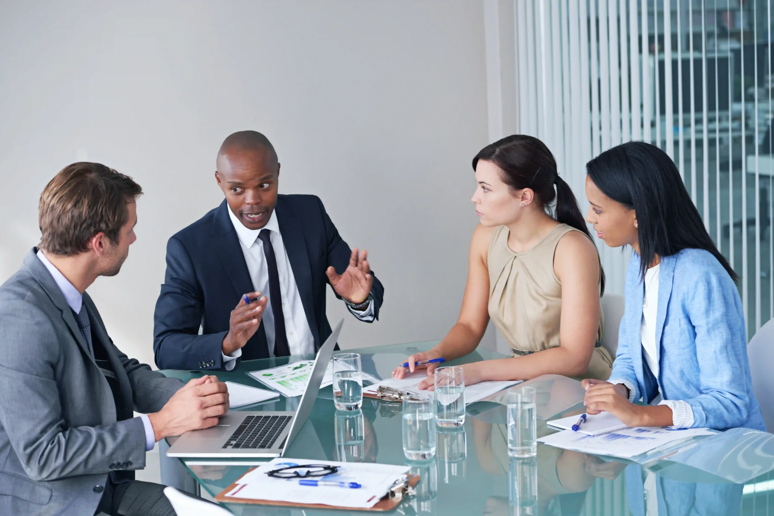 Corporate executives strategizing EPA Labeling Manual updates in a modern office setting.
