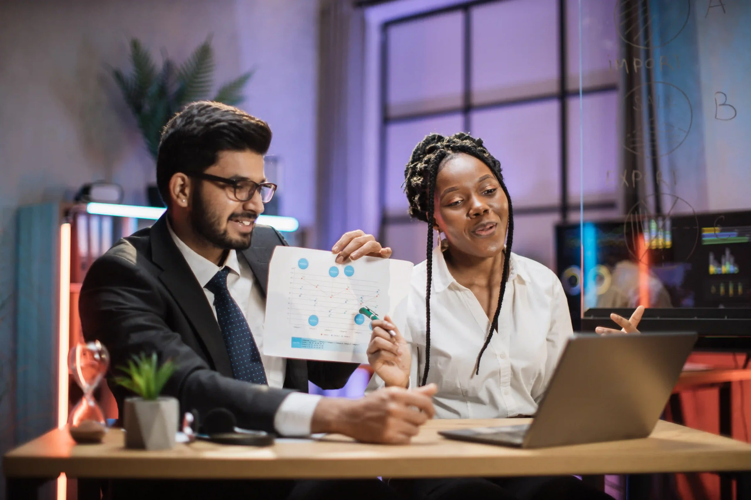 Financial professionals discussing compliance regulations in a highly regulated industry. Find out what are the most regulated industries and their impact.