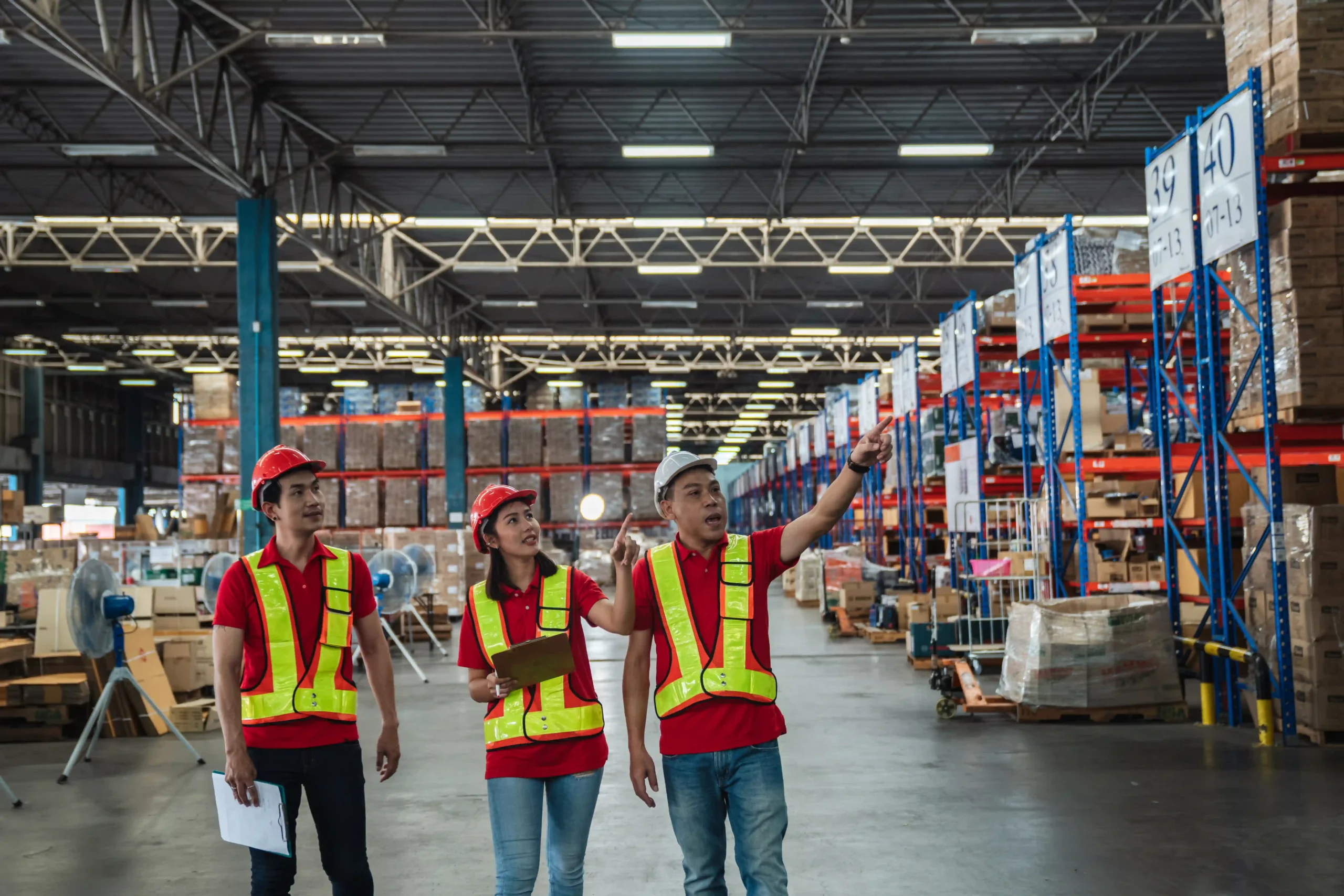 Warehouse team conducting inventory checks, showcasing efforts to streamline operations and resolve supply chain optimization challenges.