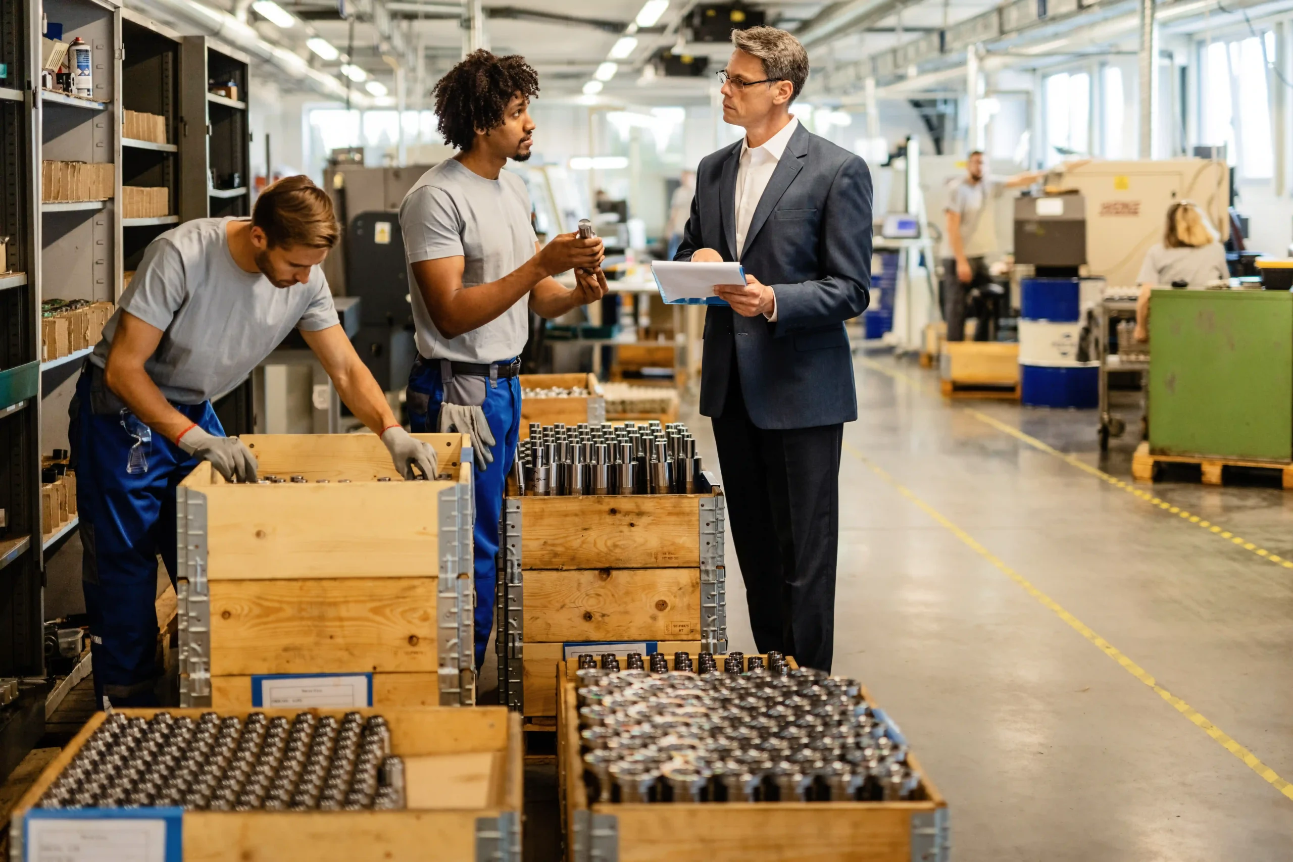 A logistics team evaluates product quality and supply chain processes using advanced supply chain network optimization tools.