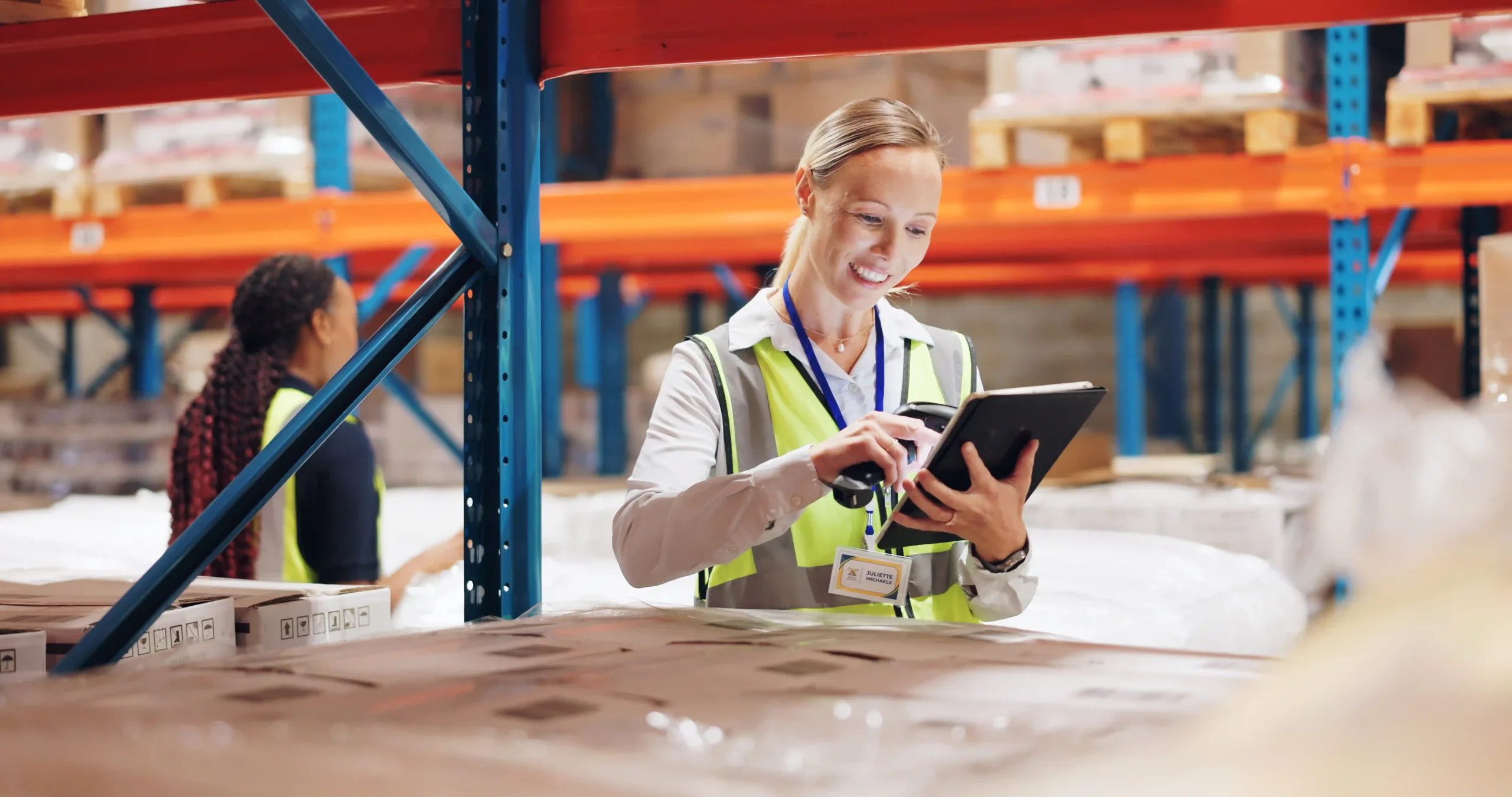 Female warehouse manager using digital tools for real-time supply chain visibility and optimization.
