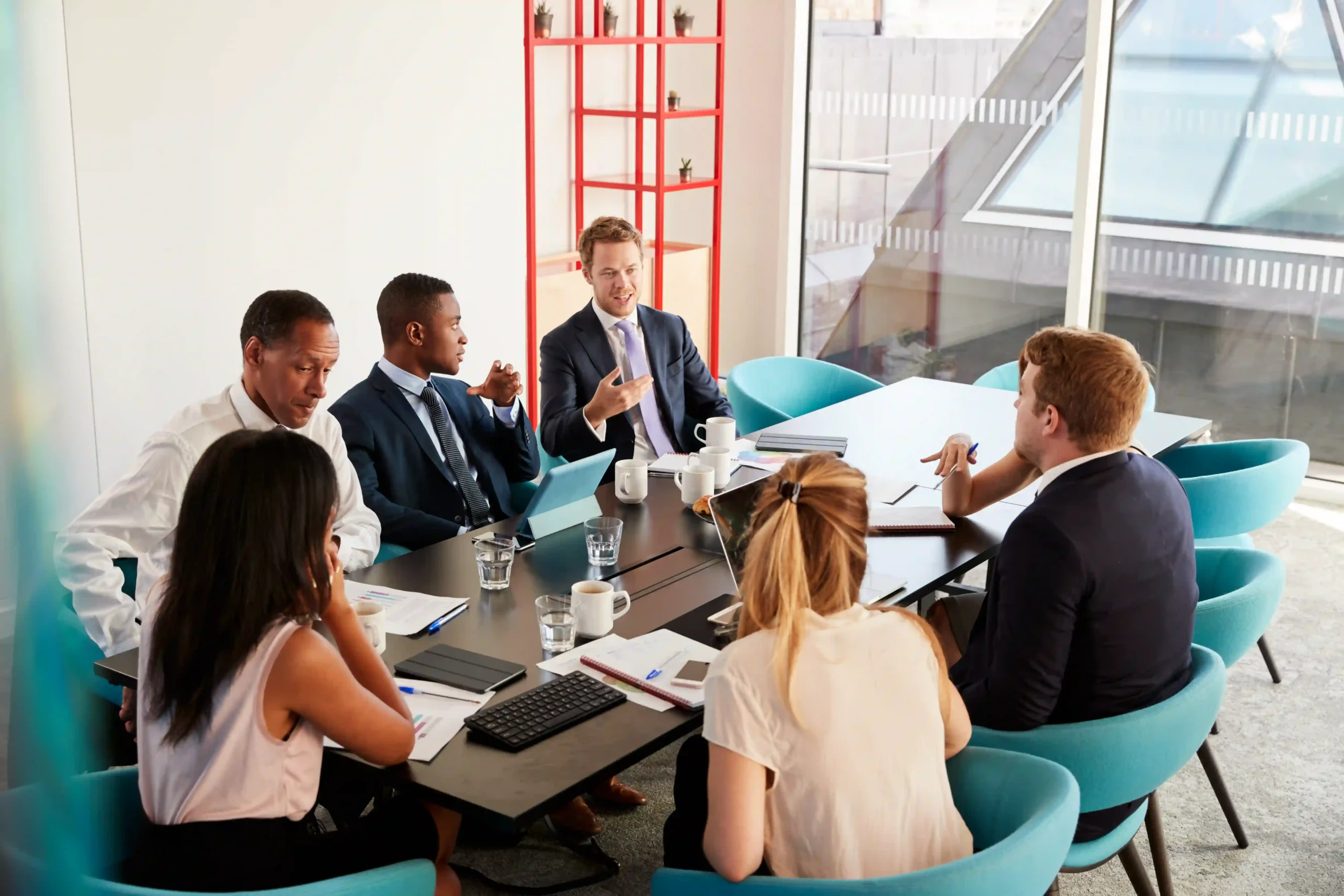 Corporate executives discussing government regulations and how the EPA regulates industry-specific compliance measures.
