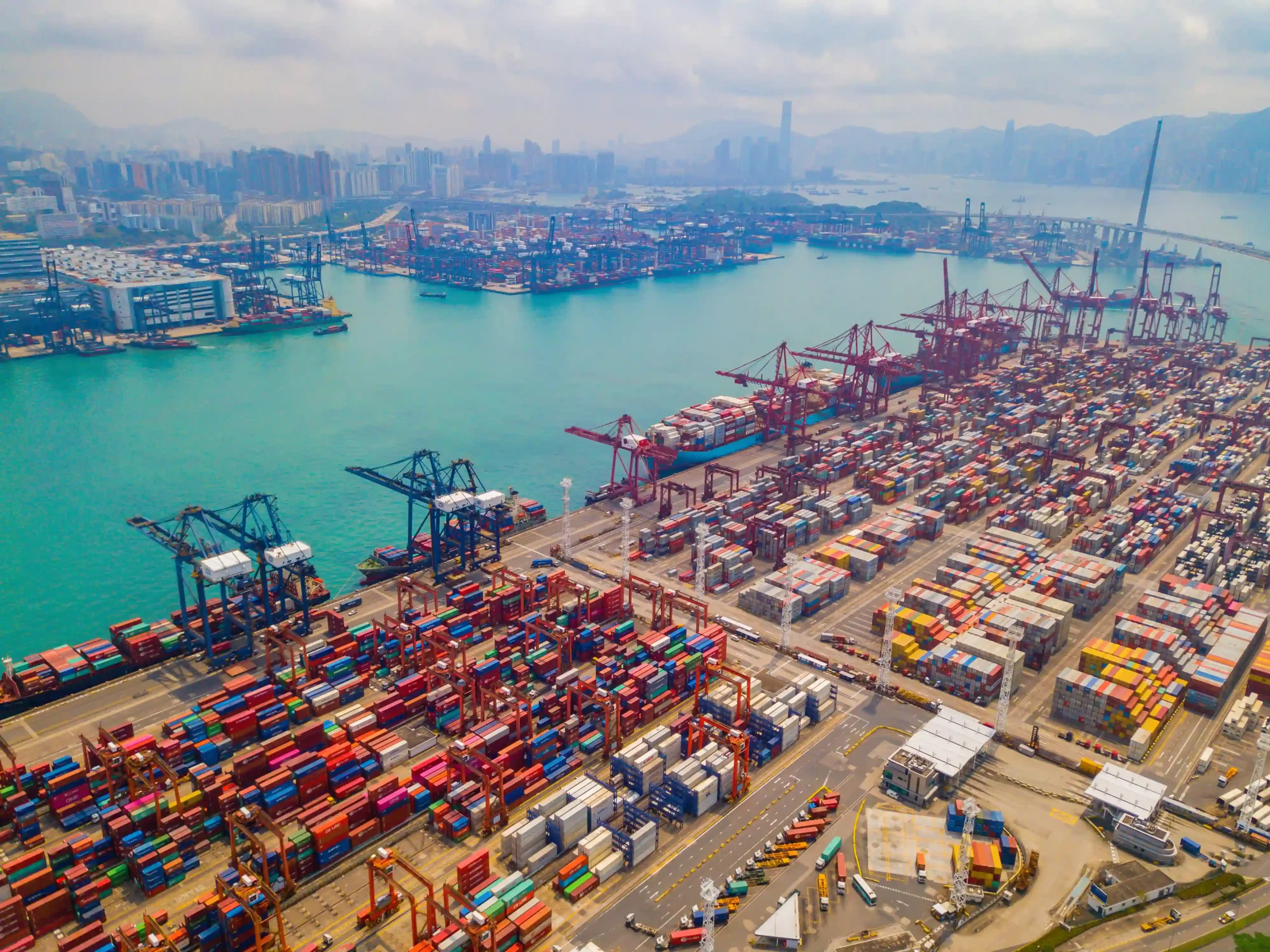 Aerial view of global shipping port adapting to international shipping regulations 2025