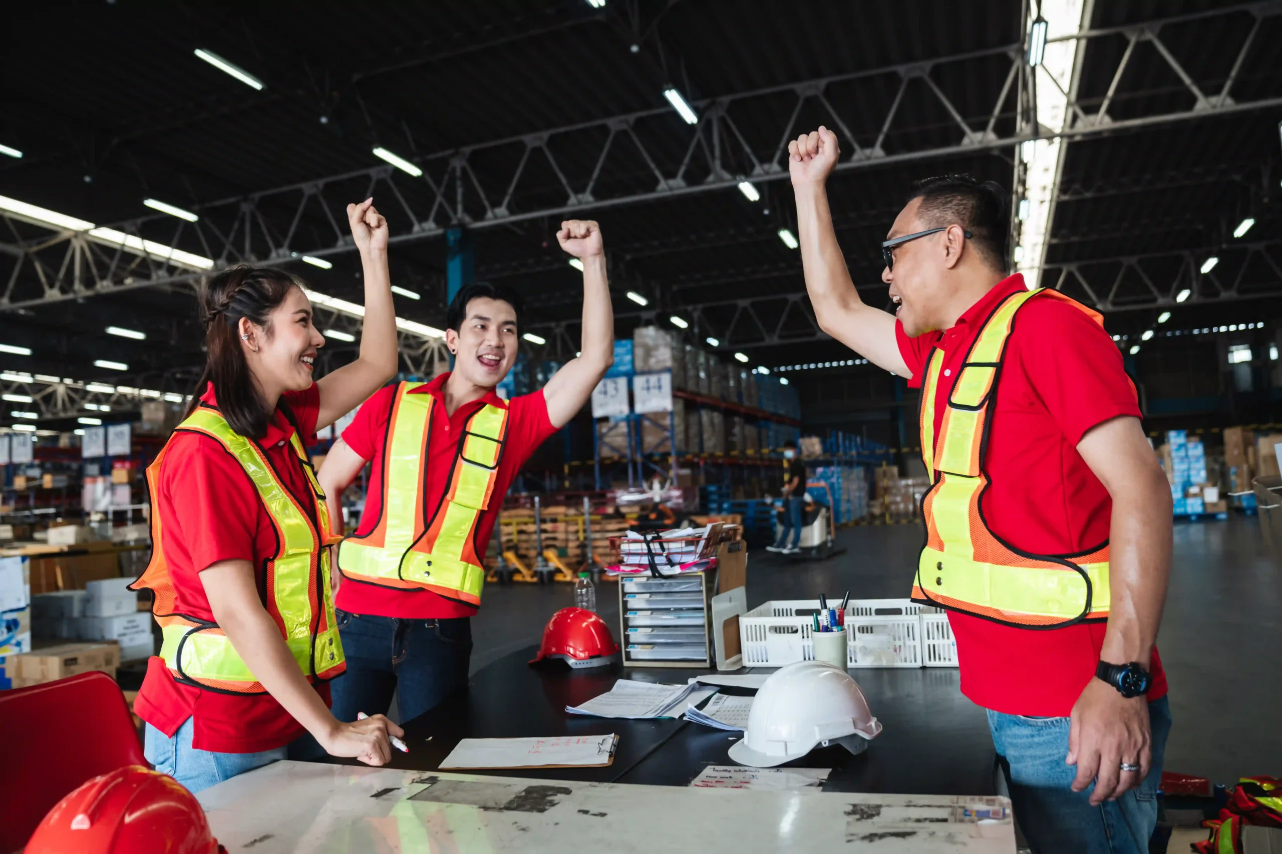 FTZ customs team celebrating operational success in a secure logistics warehouse