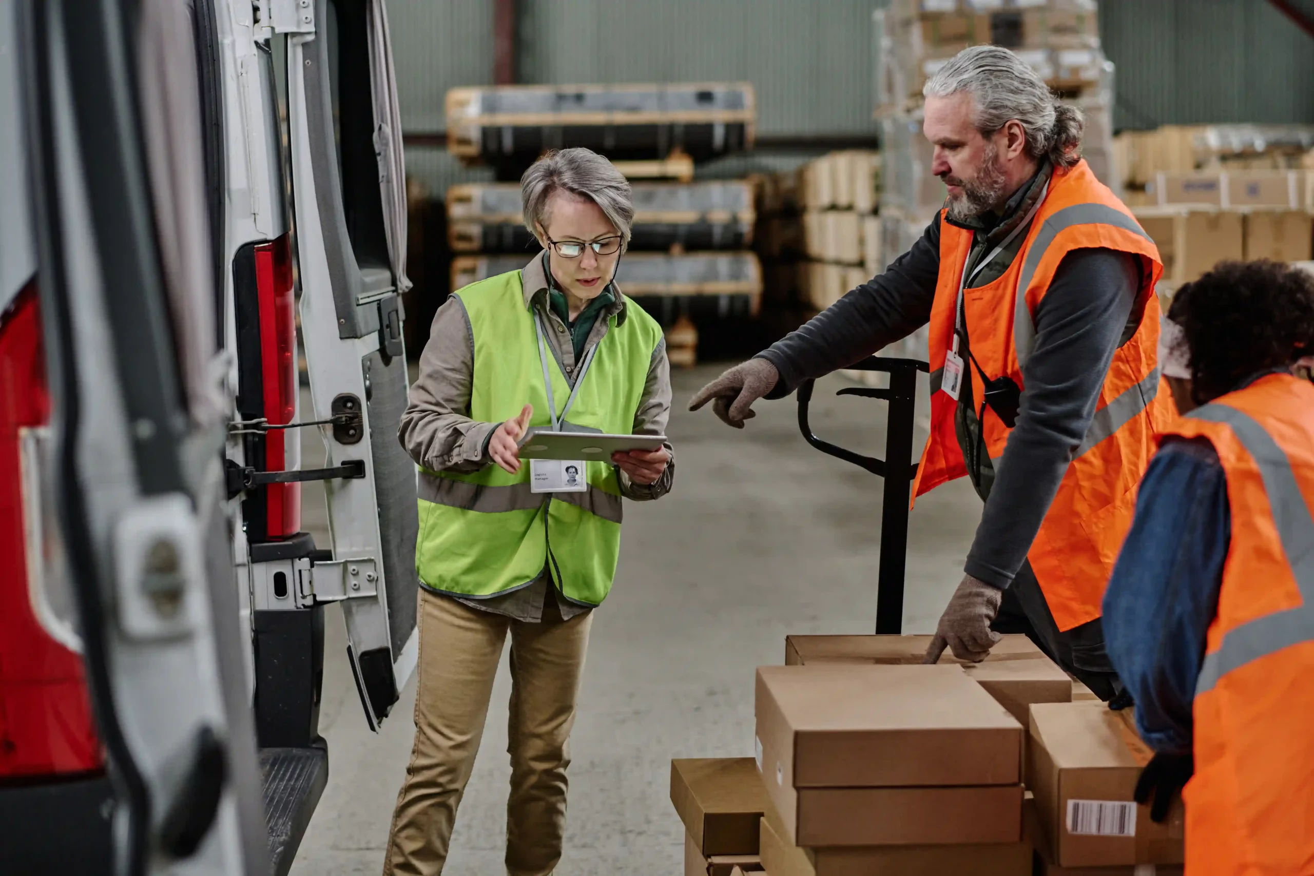 Logistics manager reviewing real-time delivery schedules during cross docking operations – cross docking news update.