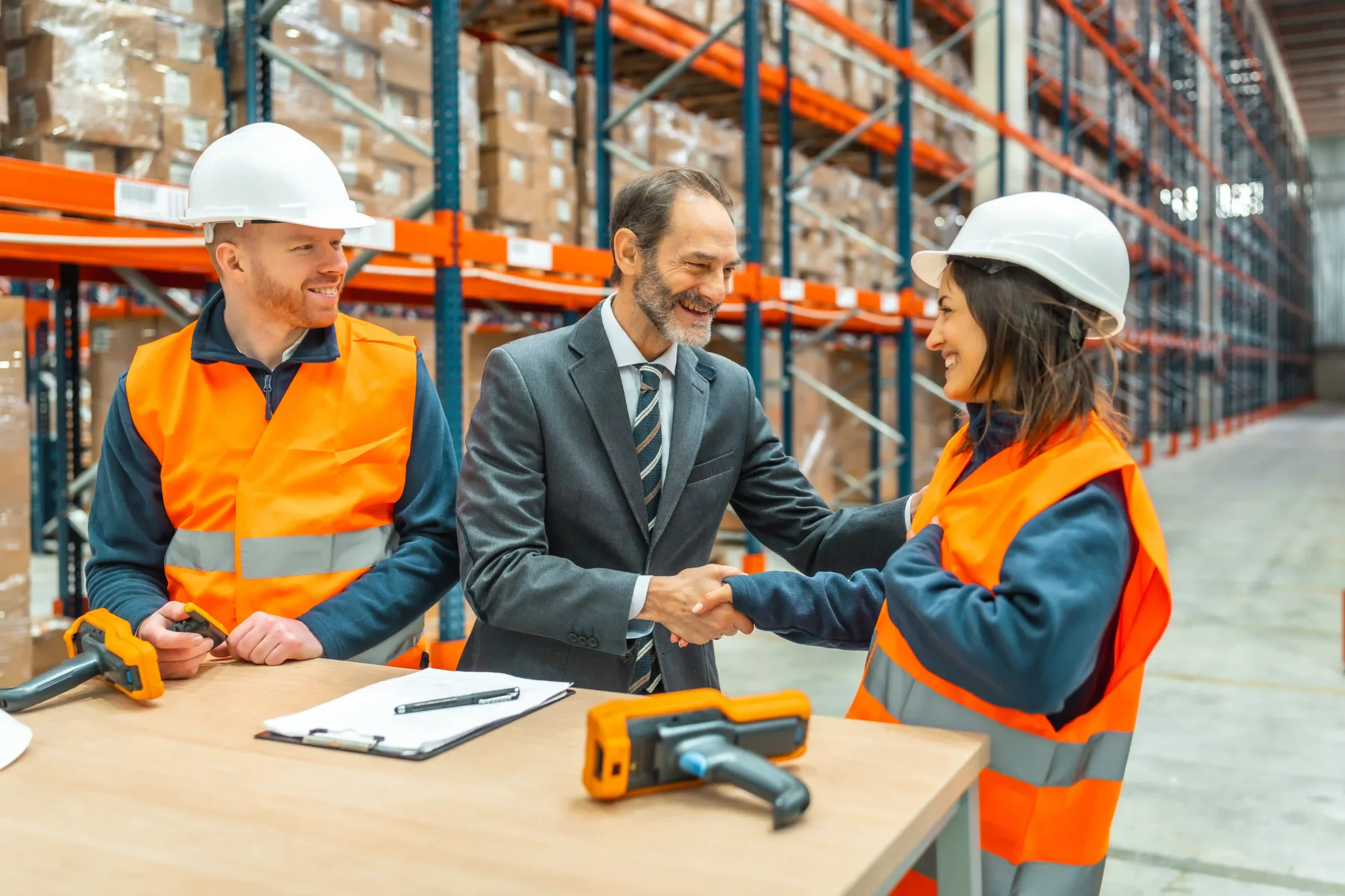 Warehouse manager and logistics partner aligning on 3PL contract logistics fulfillment goals