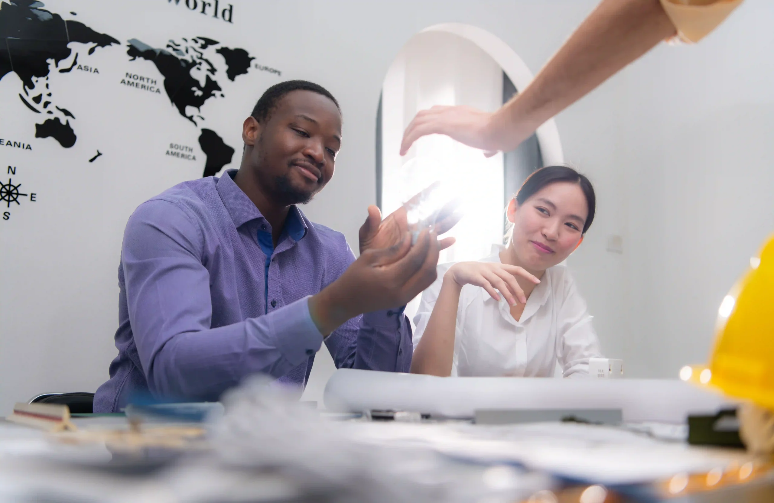 Team reviewing international trade documents as part of global trade compliance certification training