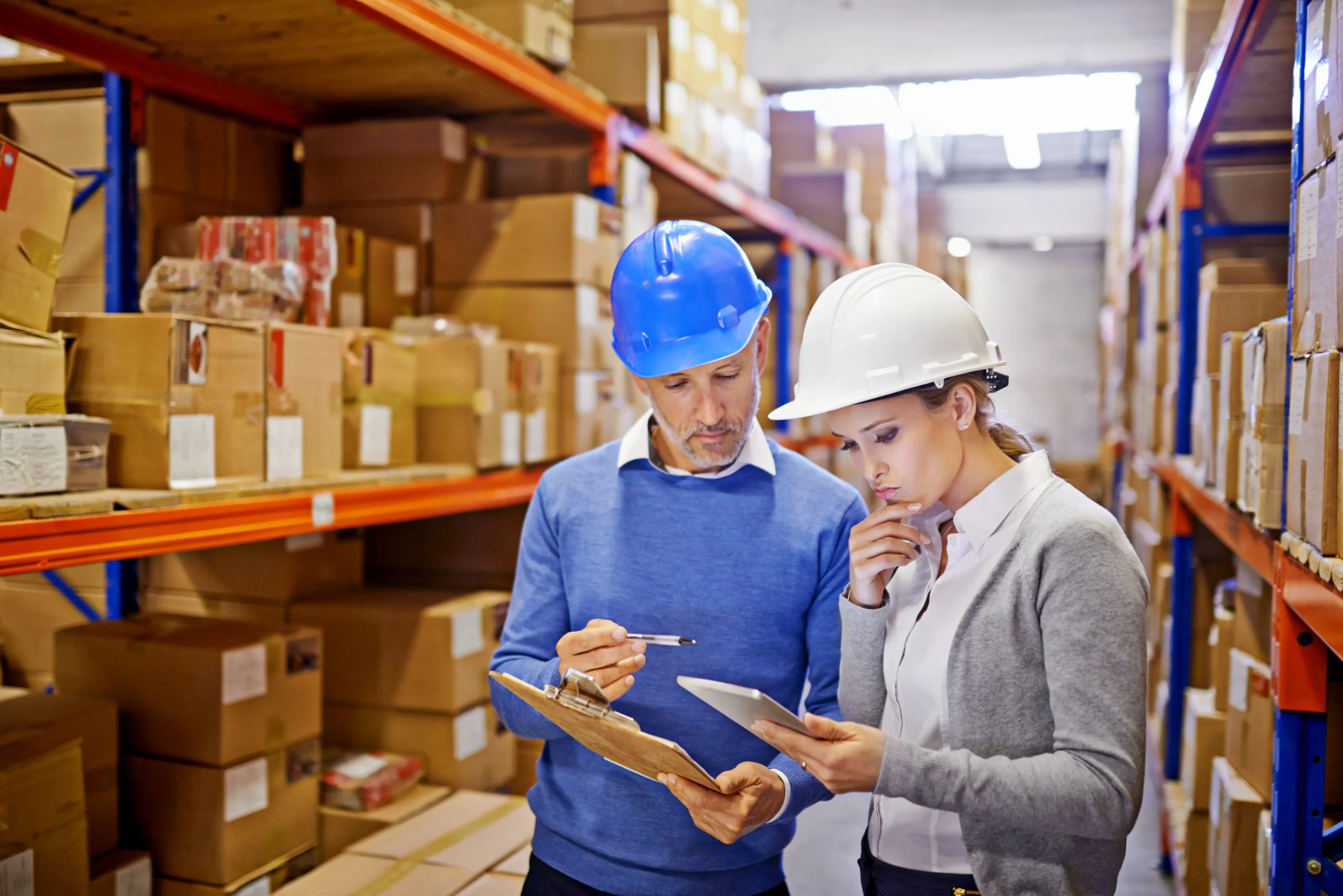 Logistics team reviewing order data in a warehouse powered by a nationwide 3PL network
