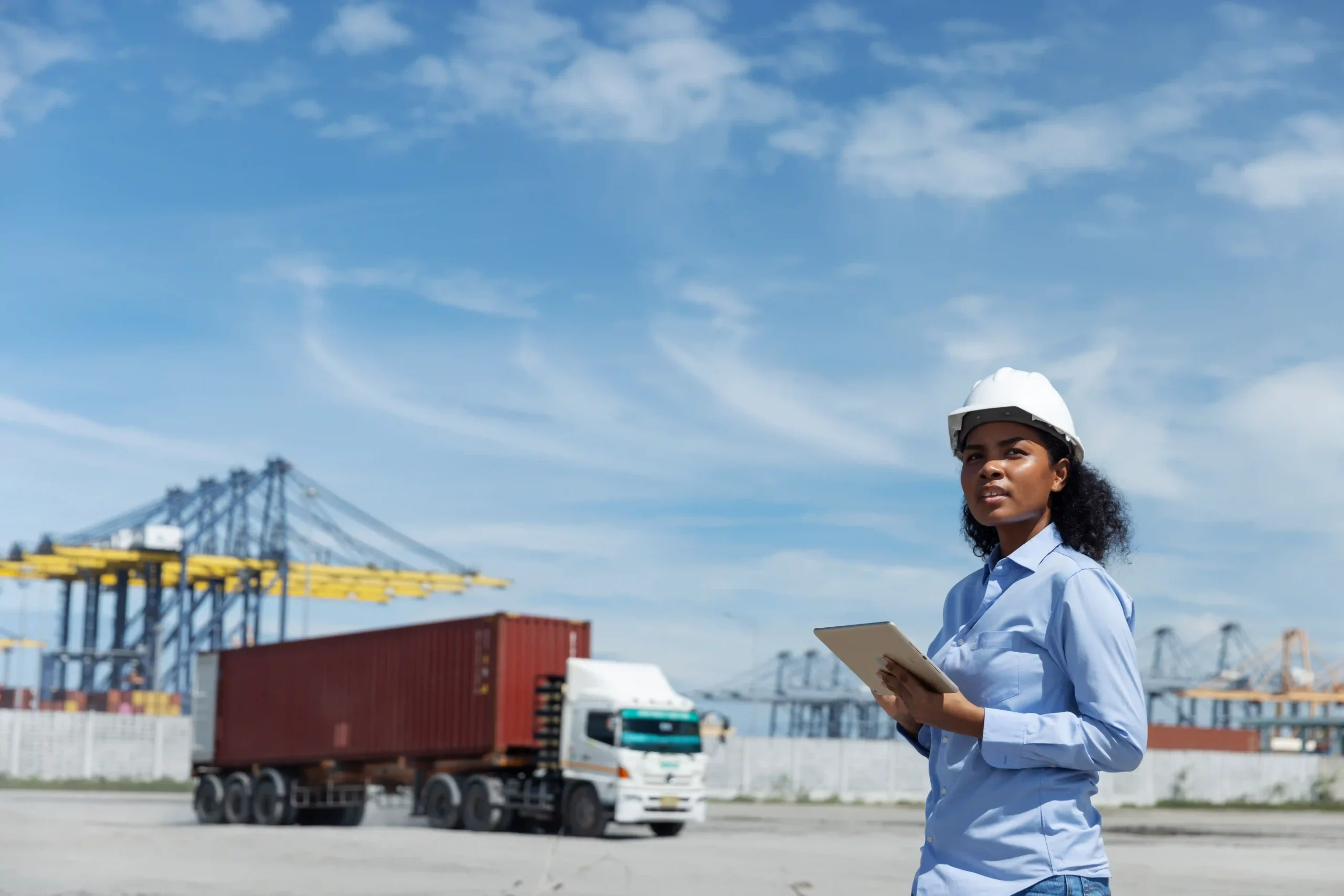 Logistics officer overseeing container transport as part of value added customer service