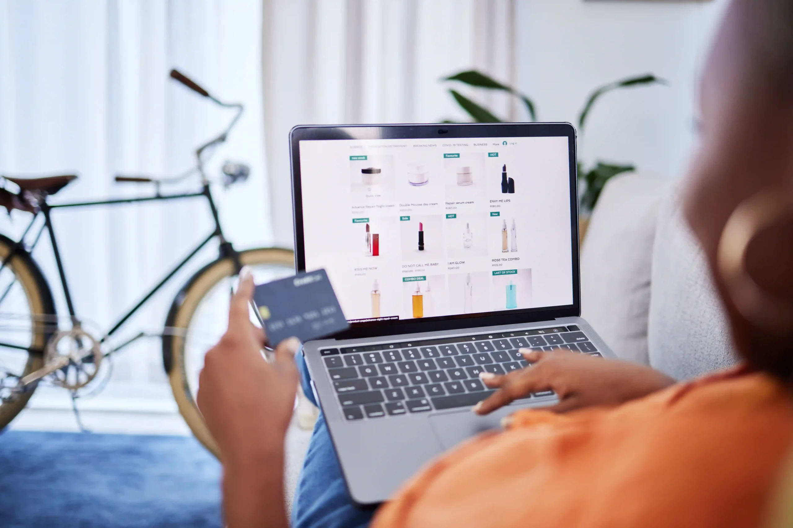 Customer shopping online from an ecommerce shipping business website using a credit card