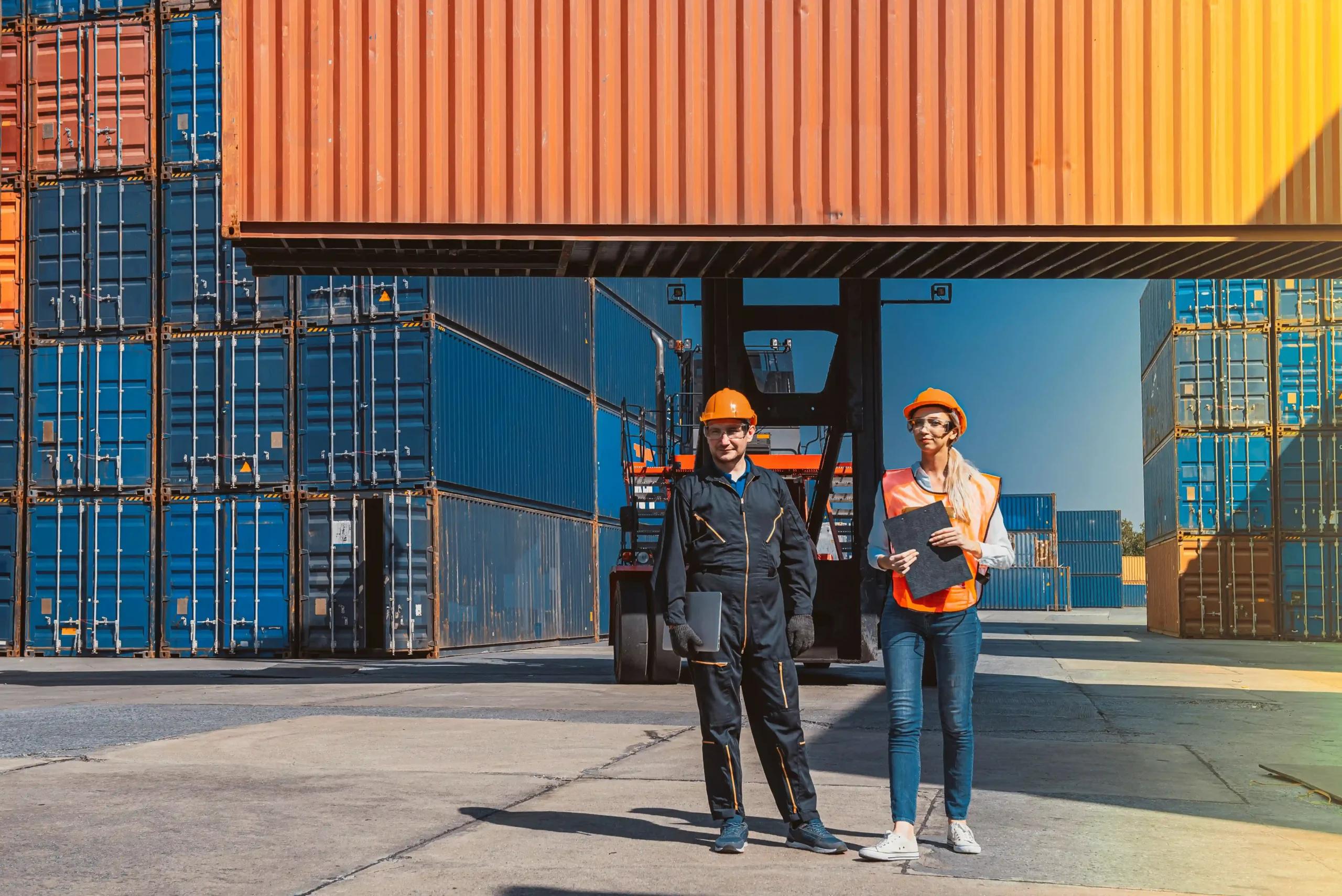 Logistics workers managing freight operations in a foreign trade zone status facility