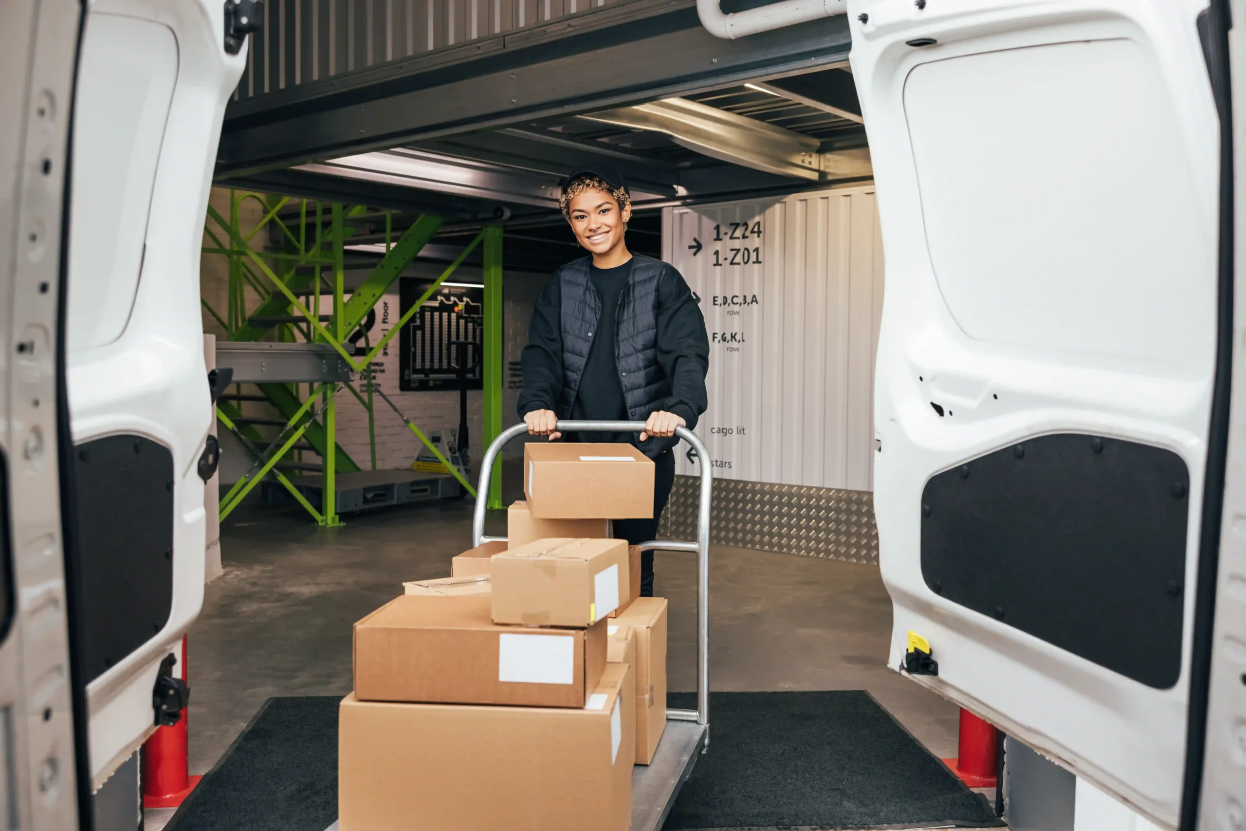 Warehouse worker preparing deliveries while managing what are the 12 elements of logistics