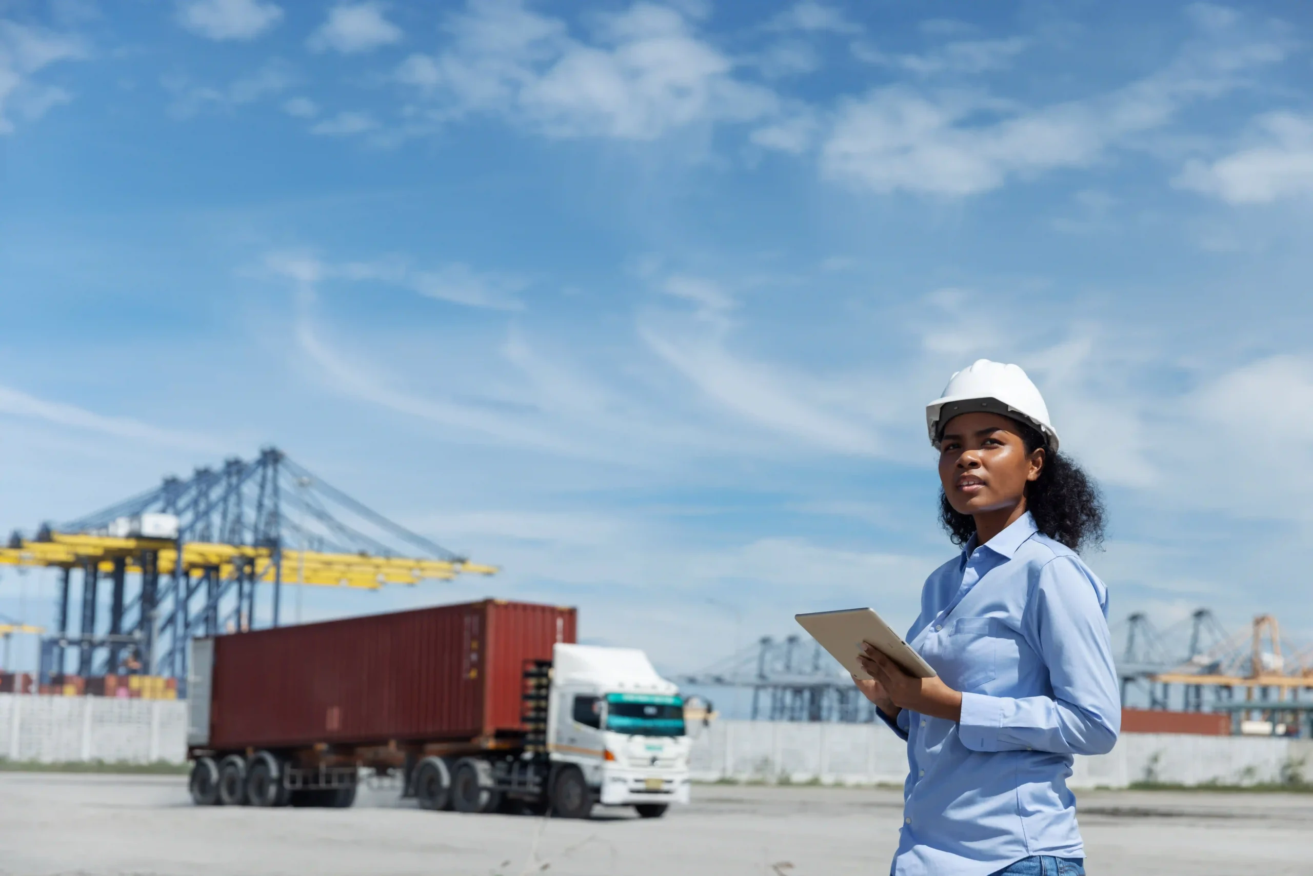 Logistics officer monitoring cargo transport, reflecting customs strategies tied to the de minimis doctrine in global trade.