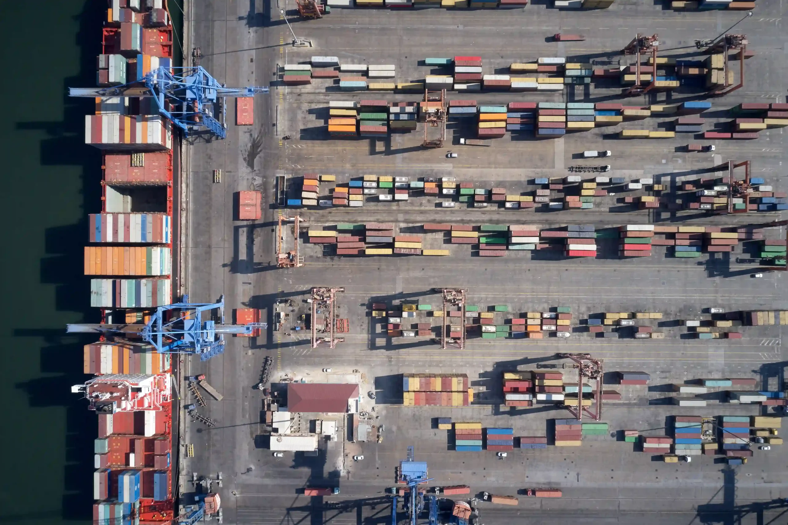 Aerial view of shipping containers at port showing trade flow under de minimis Canada to US changes.