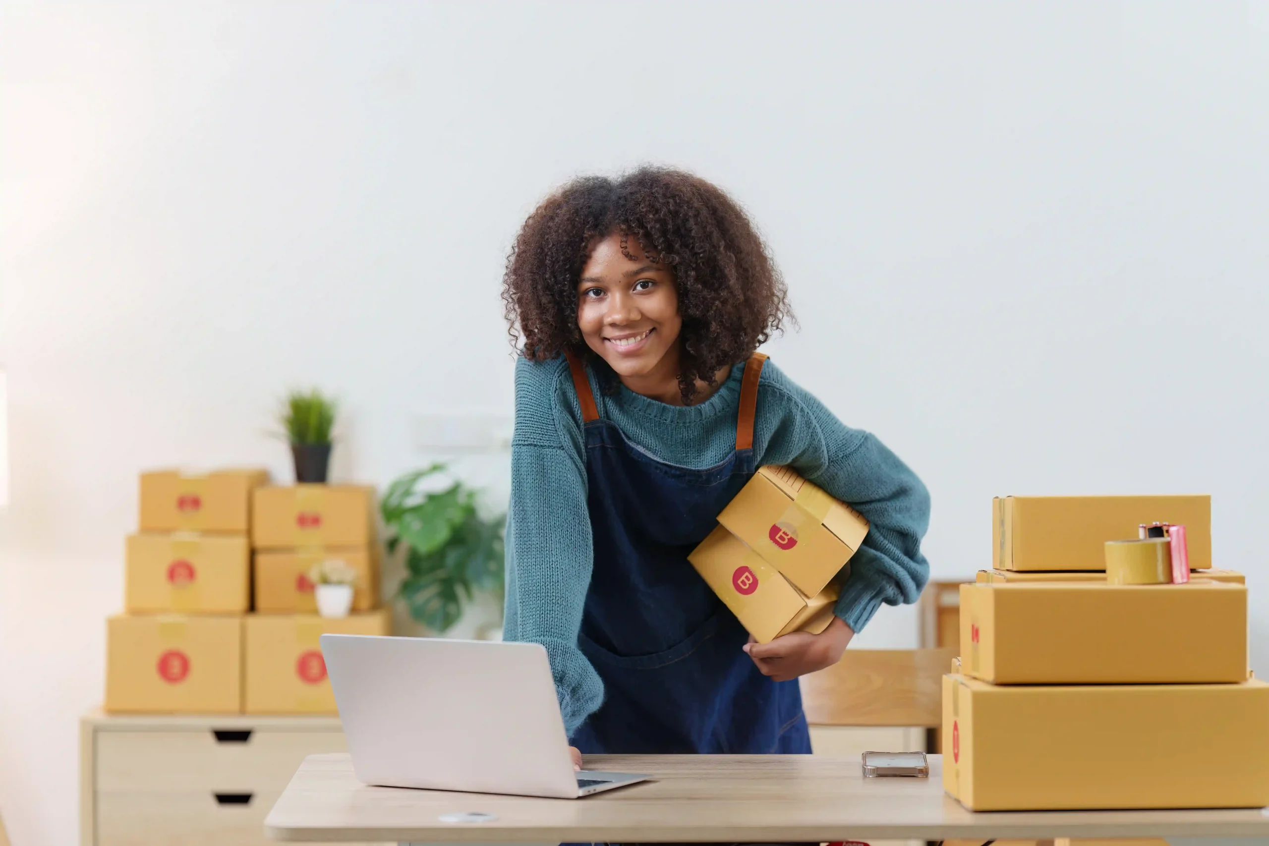 Small business owner managing shipments and researching what is de minimis in tax for e-commerce compliance.