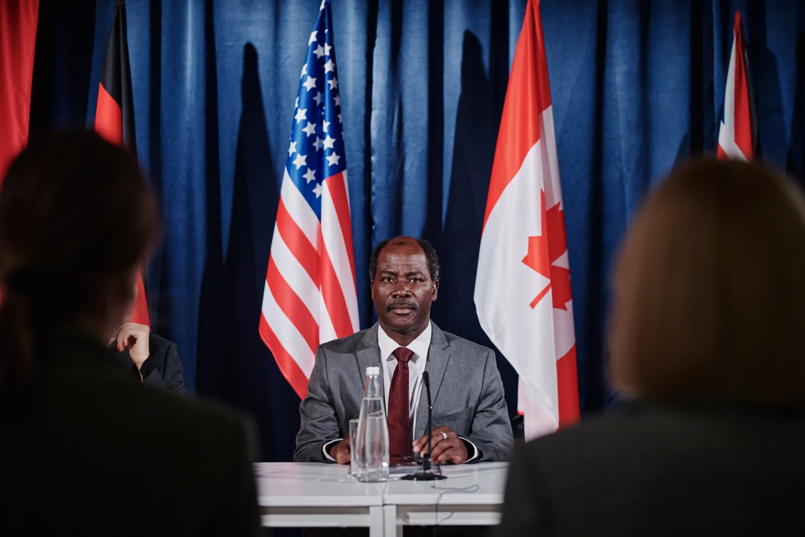 Trade representative addressing the press on new compliance rules for de minimis Canada to US shipments.