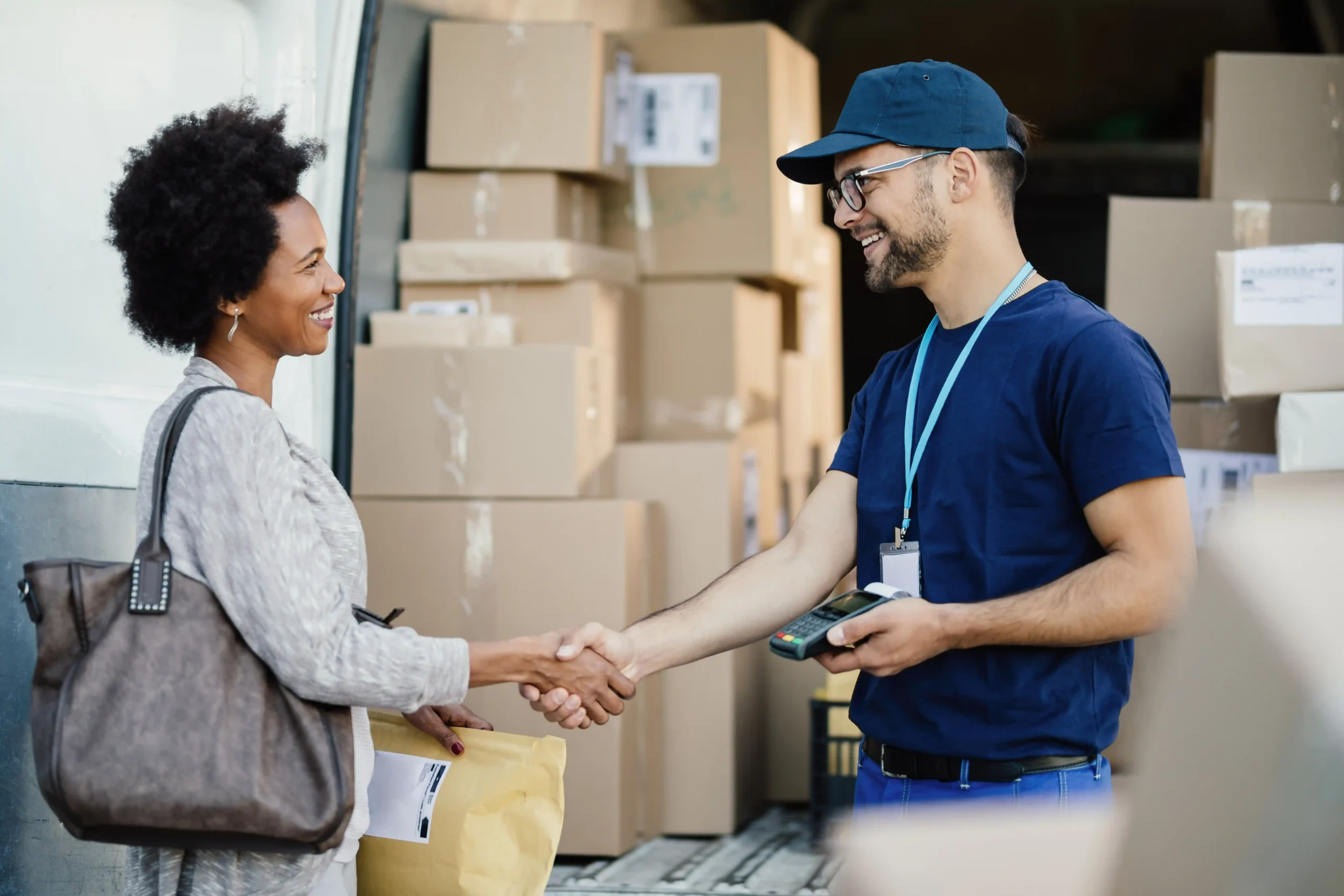 African American logistics distribution manager discussing operations and salary expectations with a delivery partner