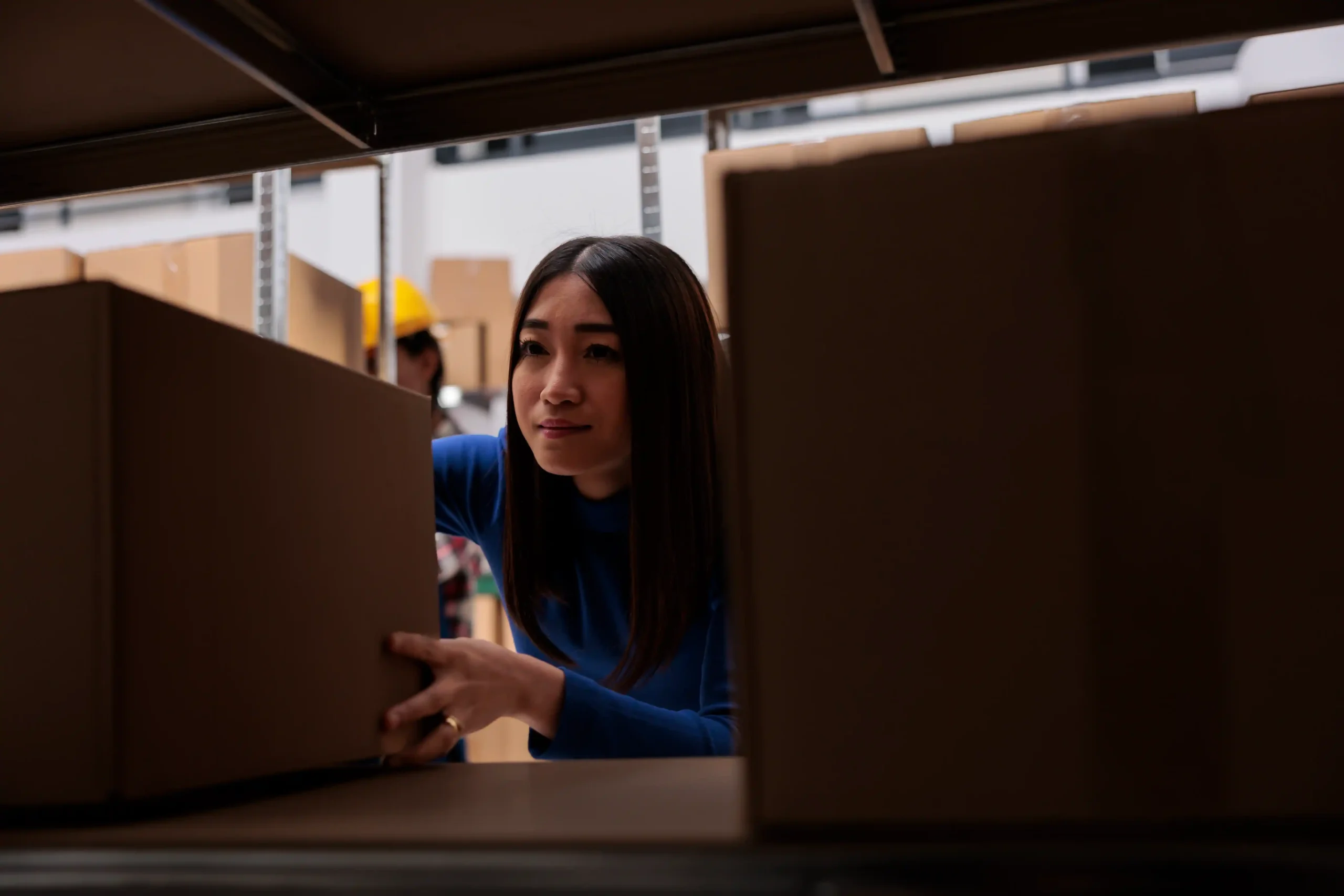 Warehouse associate retrieving inventory to support fulfillment kpis and order cycle time