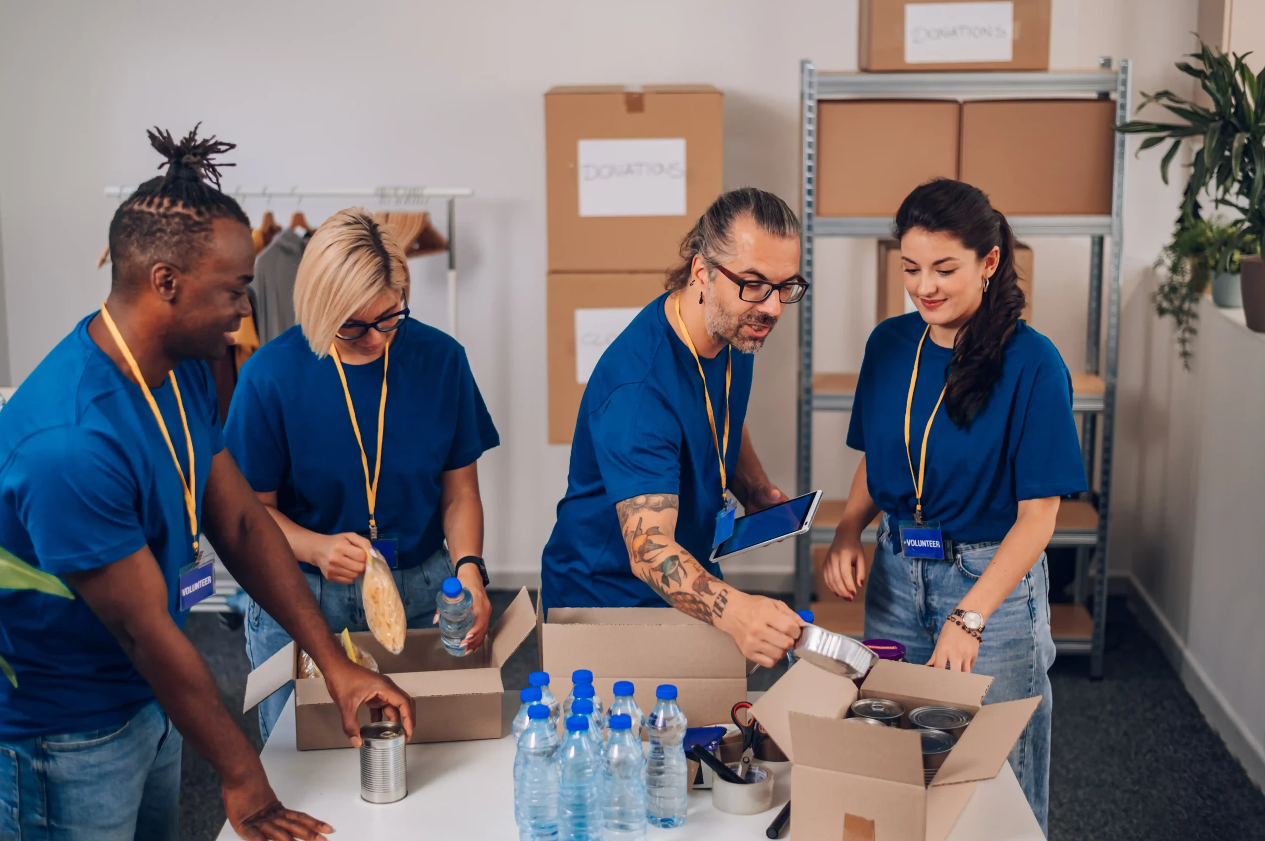 Diverse warehouse team packing boxes as part of a fulfillment services company managing organized order fulfillment