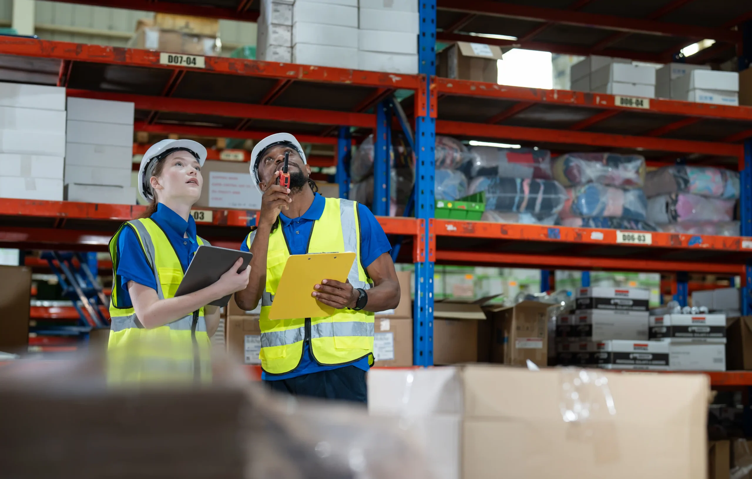 Workers conducting inventory checks as part of warehouse and storage management processes.
